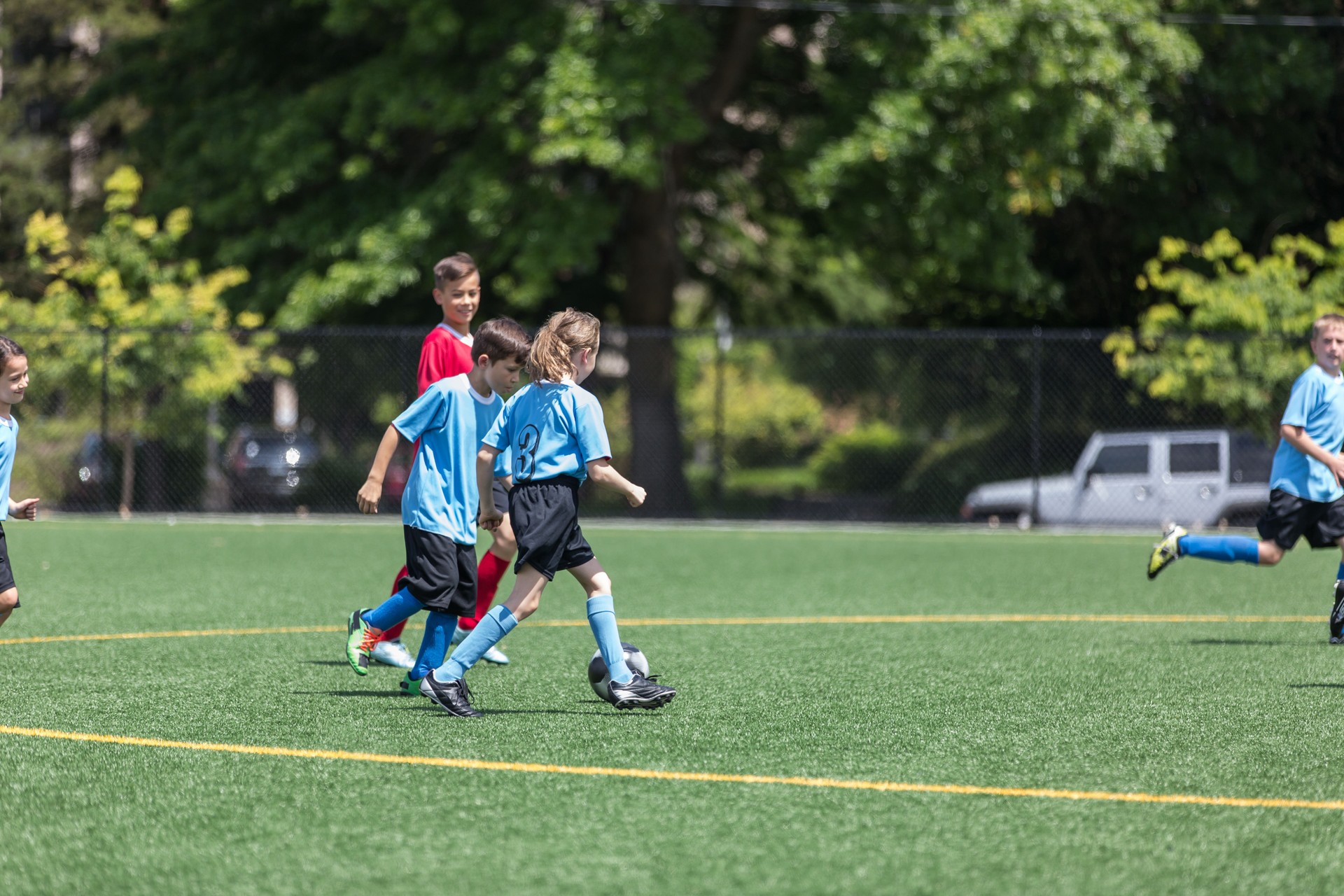 Kids practicing soccer at camp